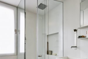 close-up-on-the-glass-shower-box-in-the-modern-bathroom-with-wooden-floor